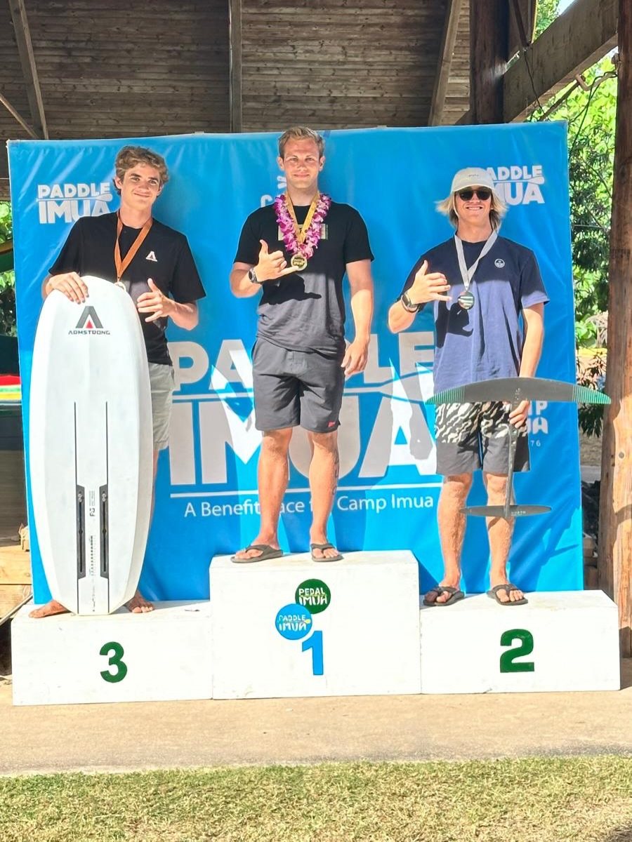 Michael Scholes on the top step of the Paddle Imua wing foil podium, 2026